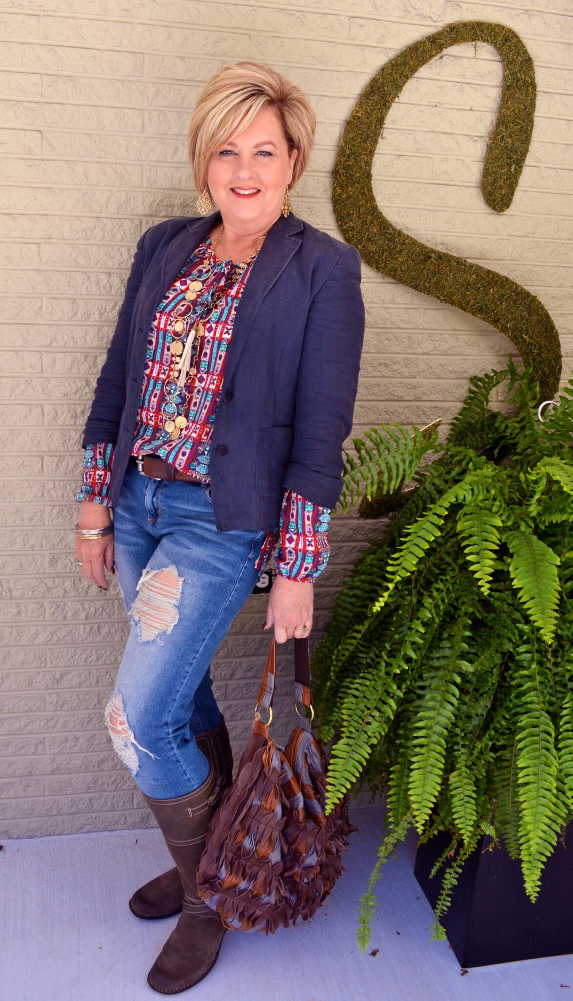 Tania wearing a boho outfit with distressed jeans