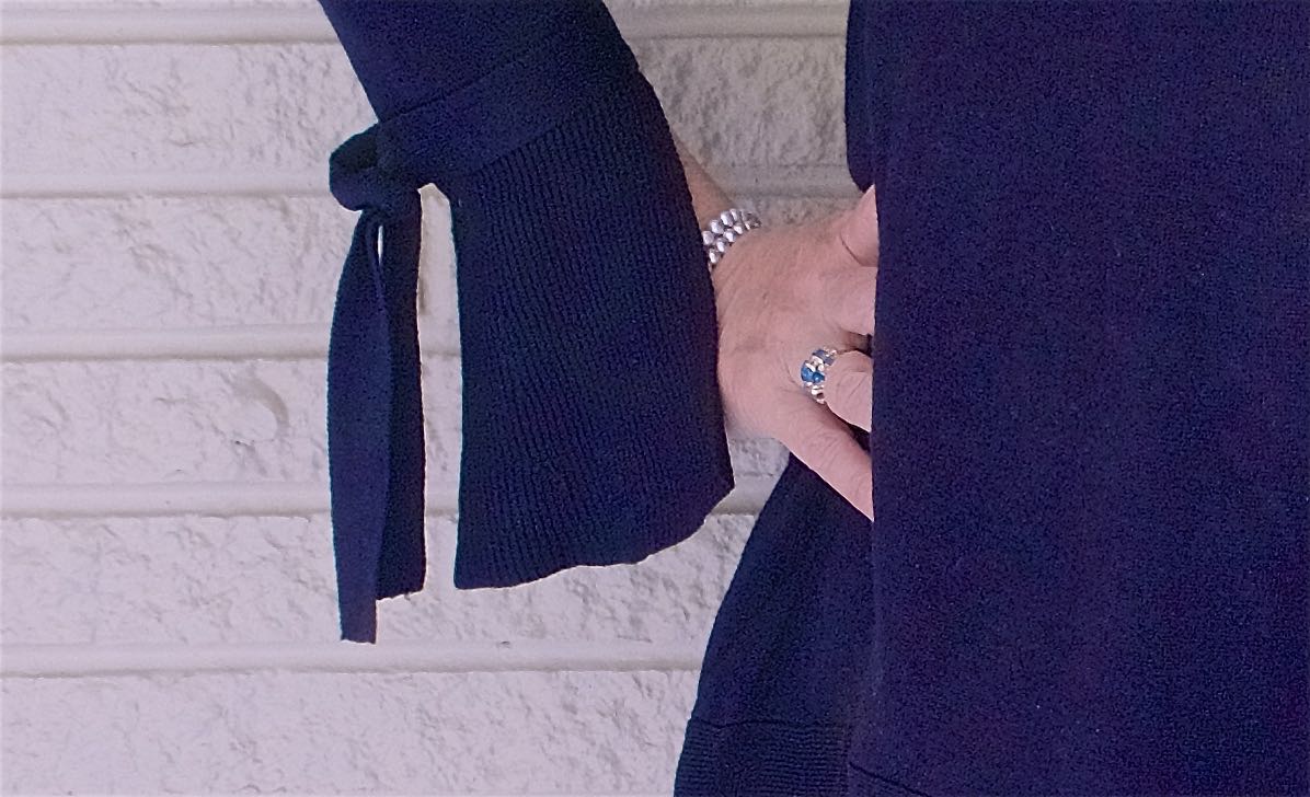 50 IS NOT OLD | WEARING A BELL SLEEVE SWEATER