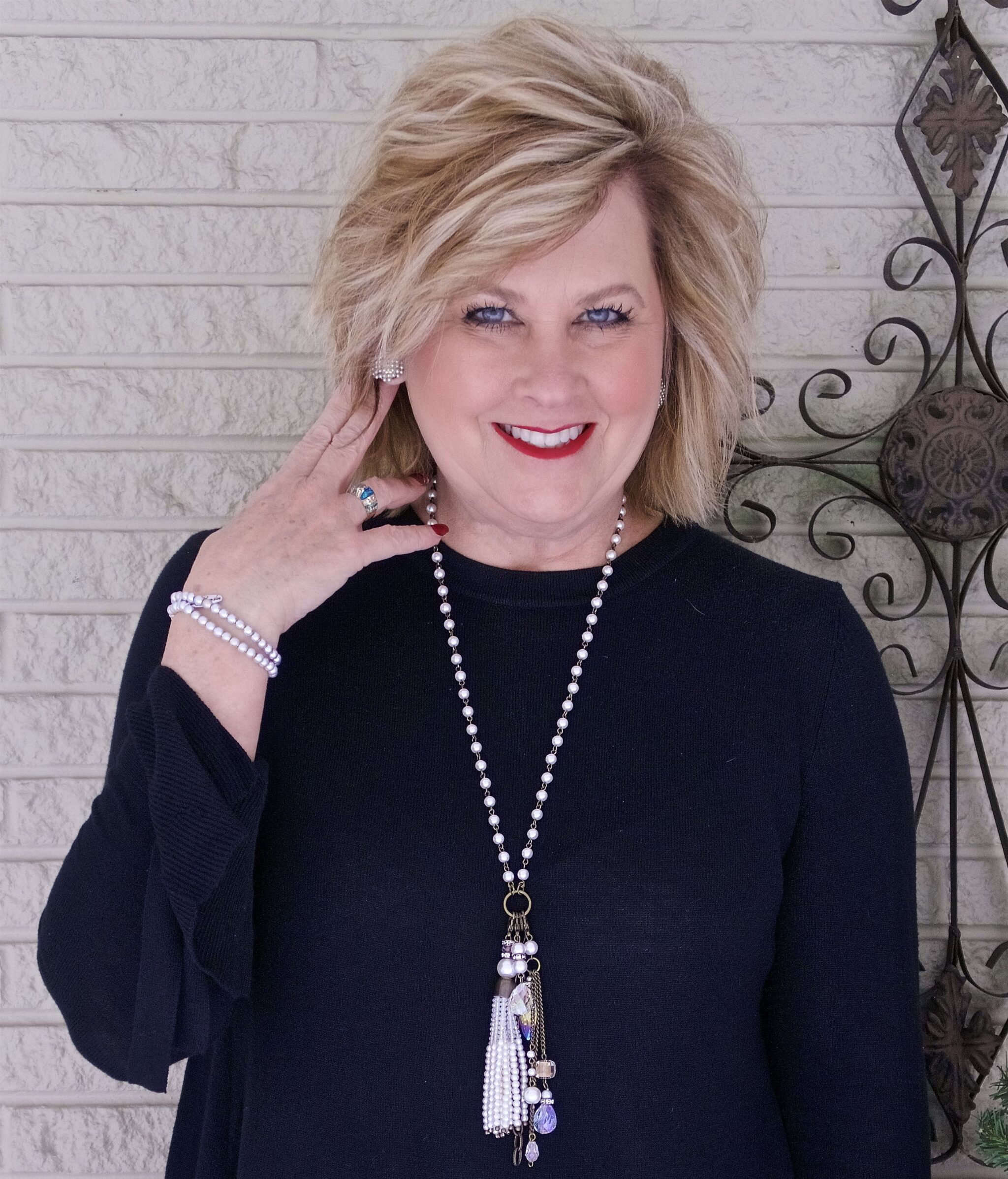 50 IS NOT OLD | WEARING A BELL SLEEVE SWEATER