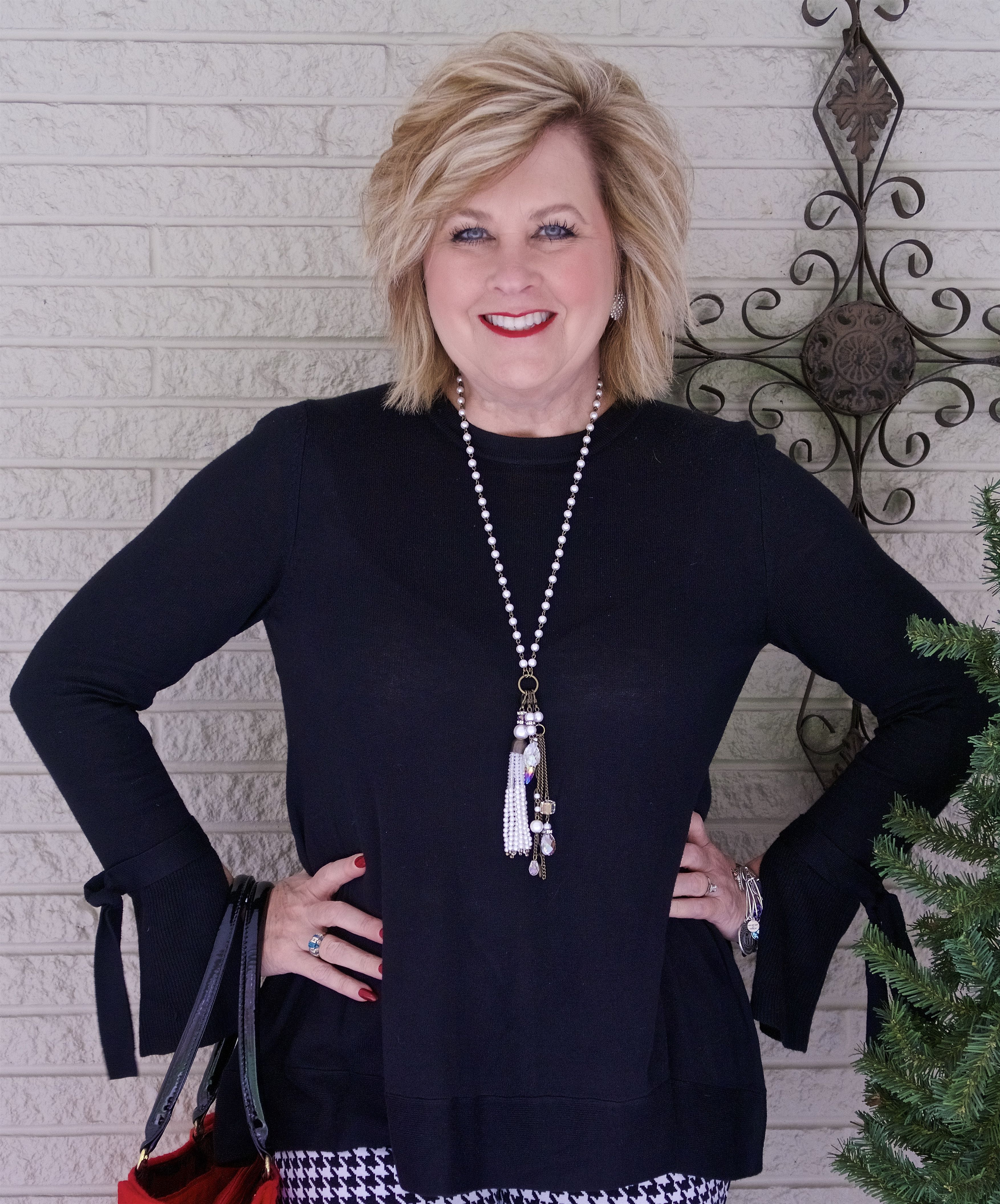 50 IS NOT OLD | WEARING A BELL SLEEVE SWEATER