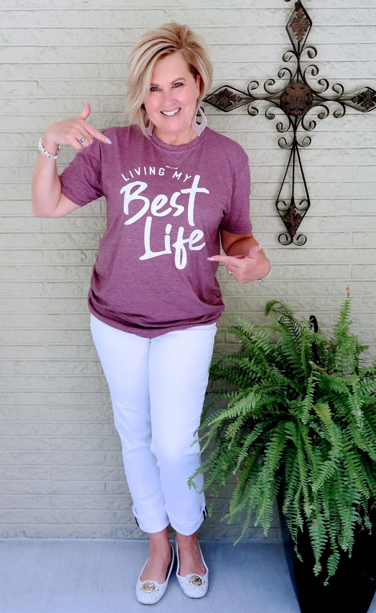 Tania wearing a Living My Best Life shirt