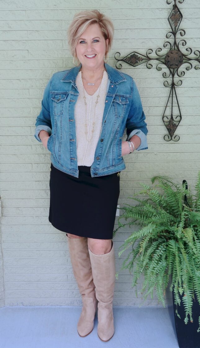 A DENIM JACKET AND KNEE HIGH BOOTS