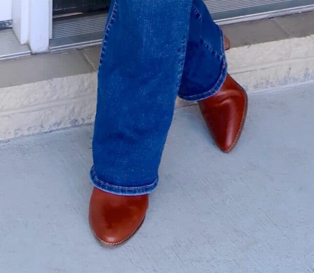 Fashion Blogger 50 Is Not Old wearing flare jeans and ankle boots