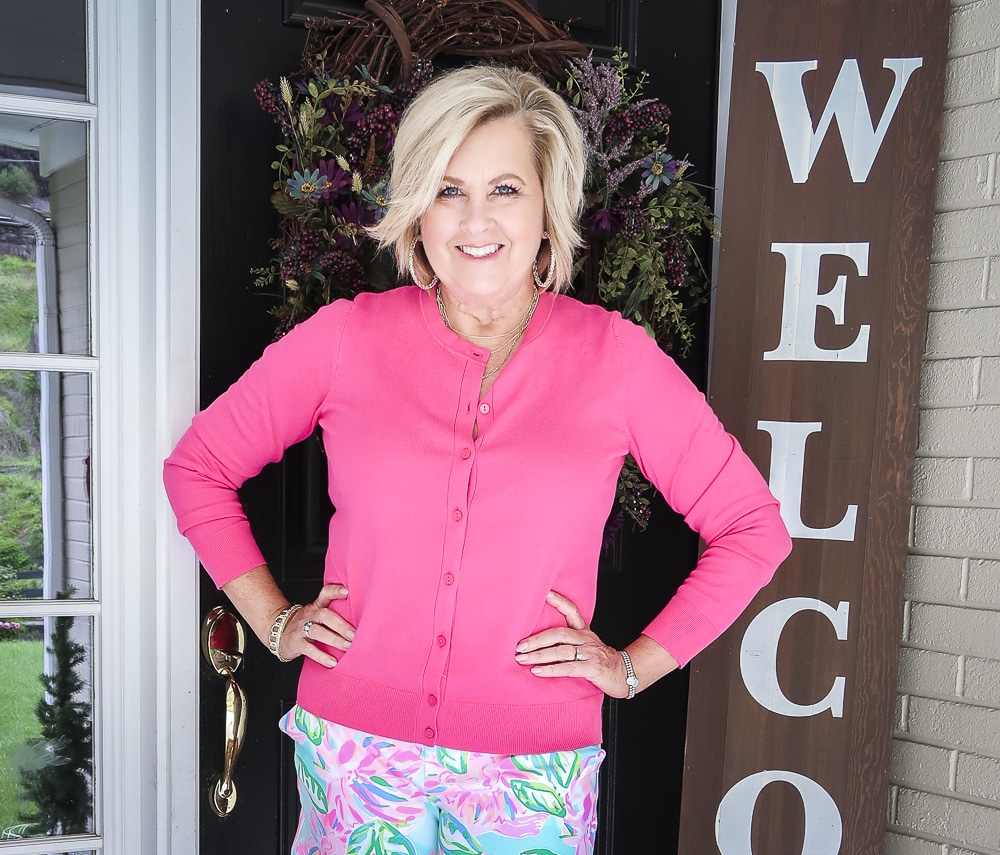Fashion Blogger 50 Is Not Old is wearing a pink cardigan from Walmart 