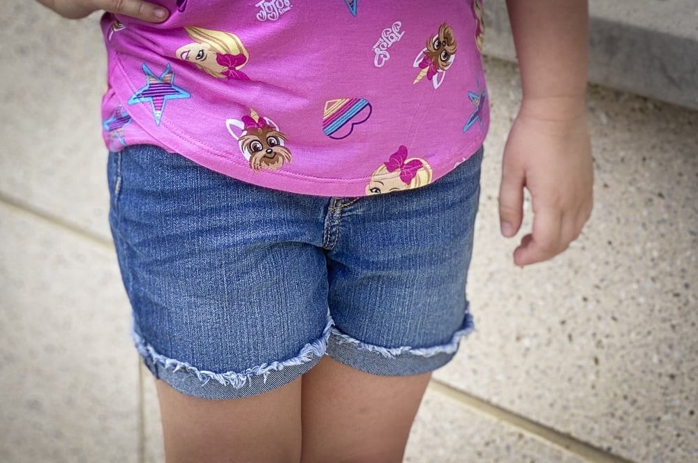 Fashion Blogger 50 Is Not Old's grandchildren in their back to school outfits. The little girl is wearing denim shorts