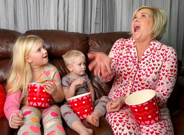 Fashion Blogger 50 Is Not Old is creating memories with her grandchildren in their PJs and eating popcorn