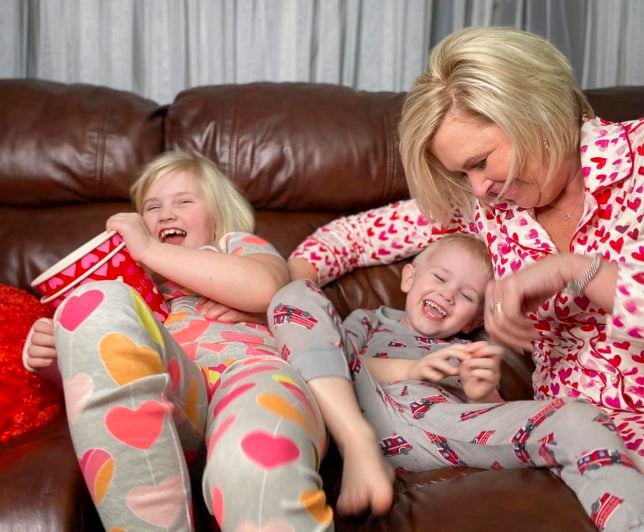 Fashion Blogger 50 Is Not Old is tickling her grandchildren in their PJs 