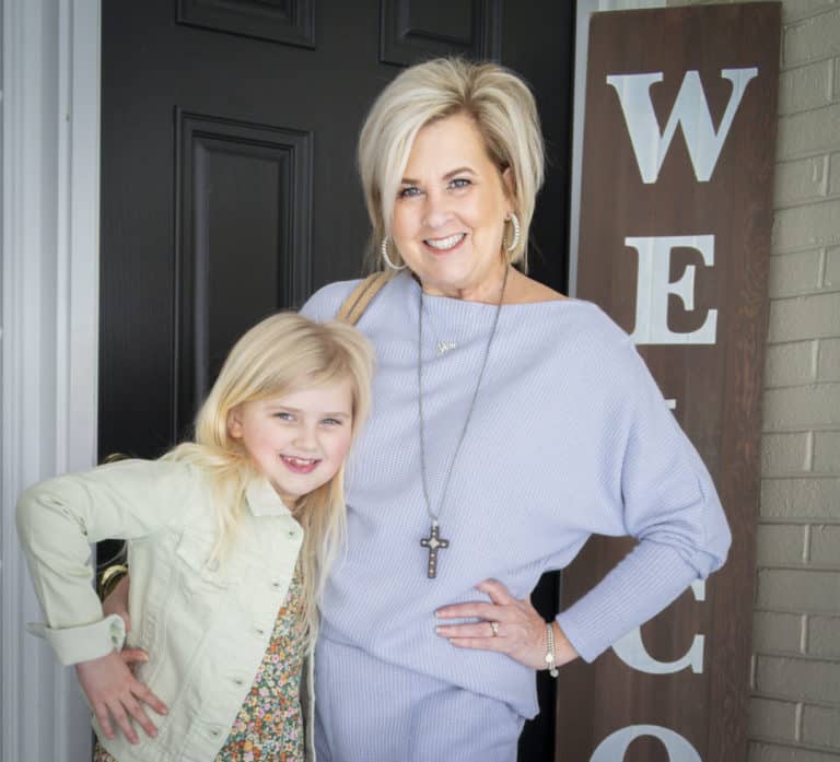 Fashion Blogger 50 Is Not Old is wearing a light blue loungewear sweater set with her granddaughter