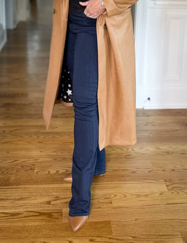 Fashion Blogger 50 Is Not Old is wearing dark wash jeans with brown pointy toe boots