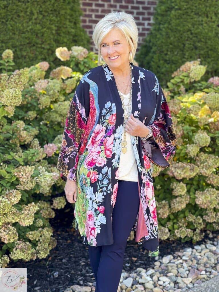 Over 40 Fashion Blogger, Tania Stephens is wearing a statement making Peacock Ruana from Chico's