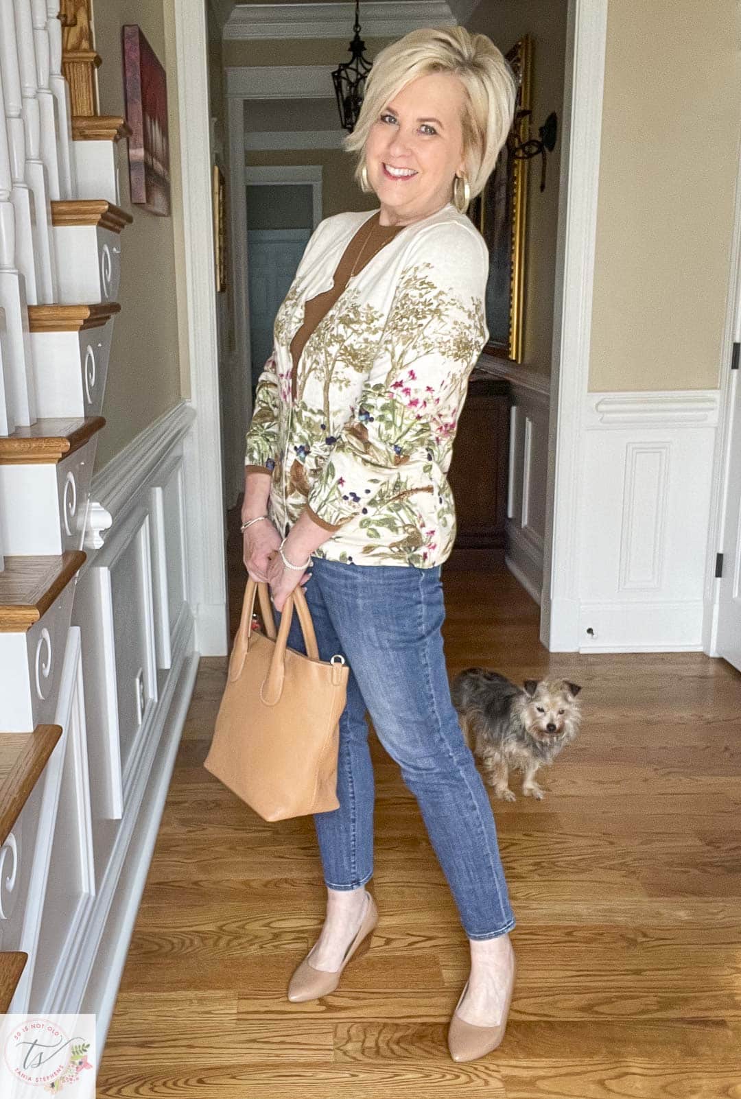 Over 40 Fashion Blogger, Tania Stephens is wearing a pheasant cardigan, girlfriend jeans, and carrying a camel leather handbag that is perfect for Thanksgiving