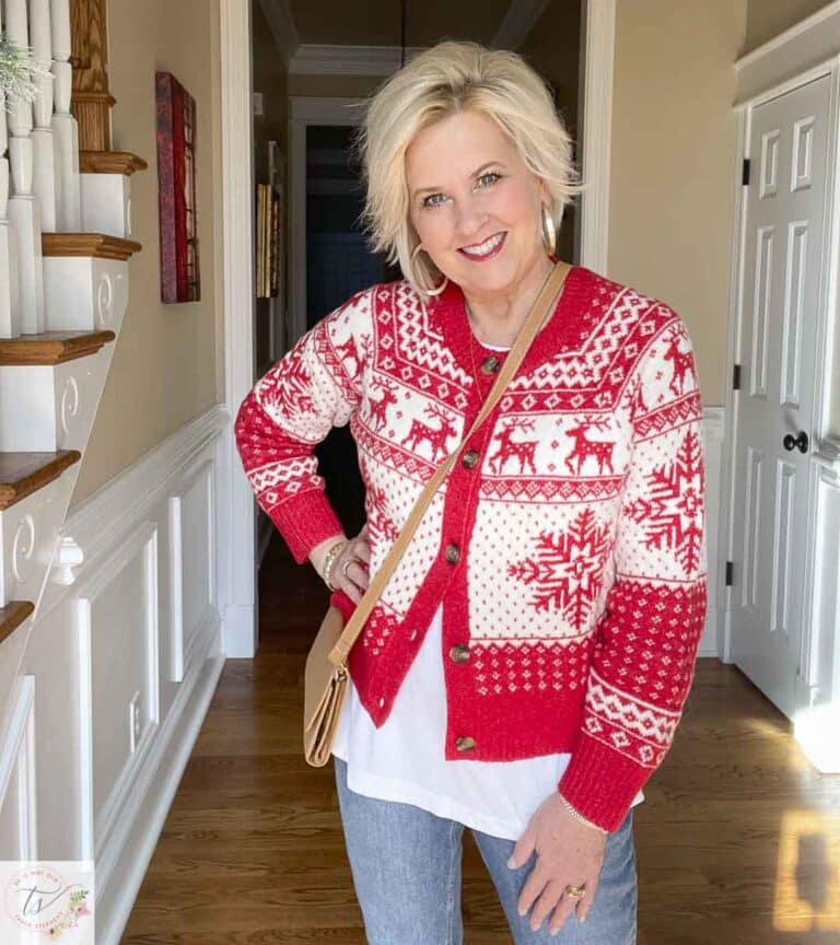 Over 40 Fashion Blogger, Tania Stephens is wearing a red and white festive sweater with a white tank