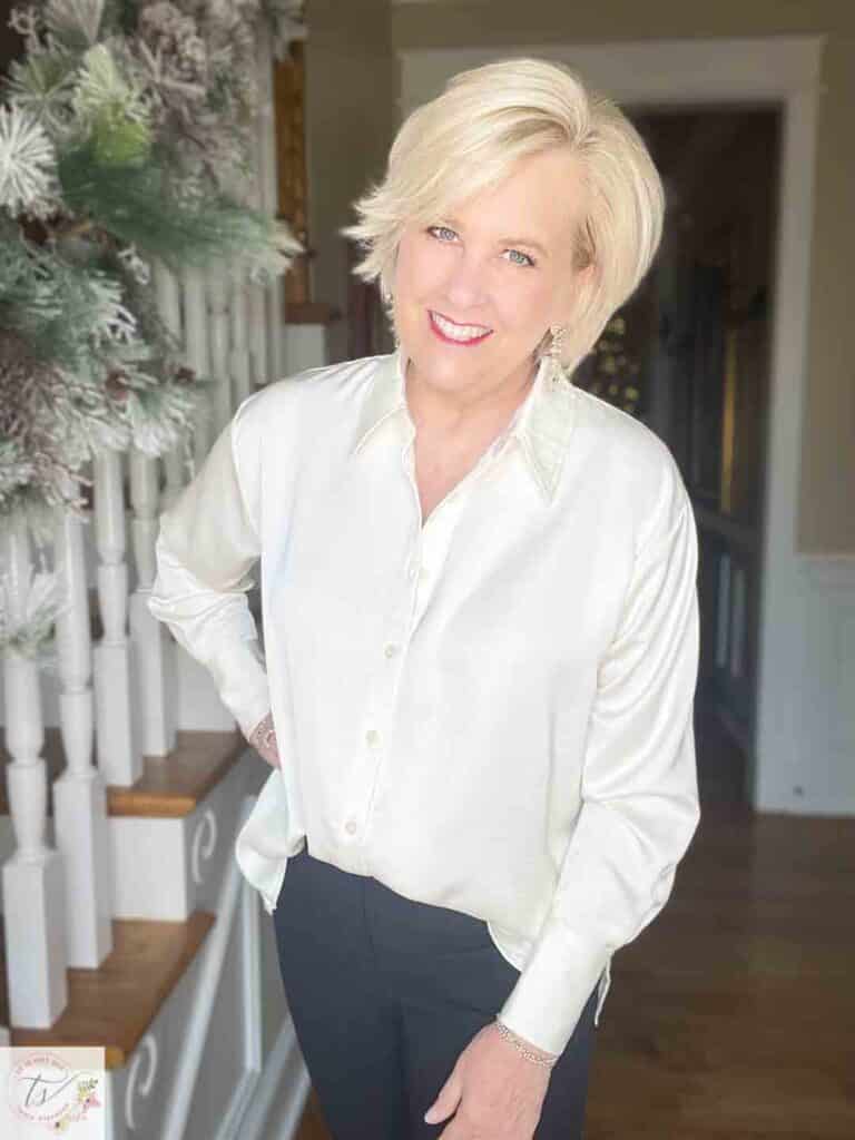 Over 40 Fashion Blogger, Tania Stephens is wearing a cream satin shirt from Target