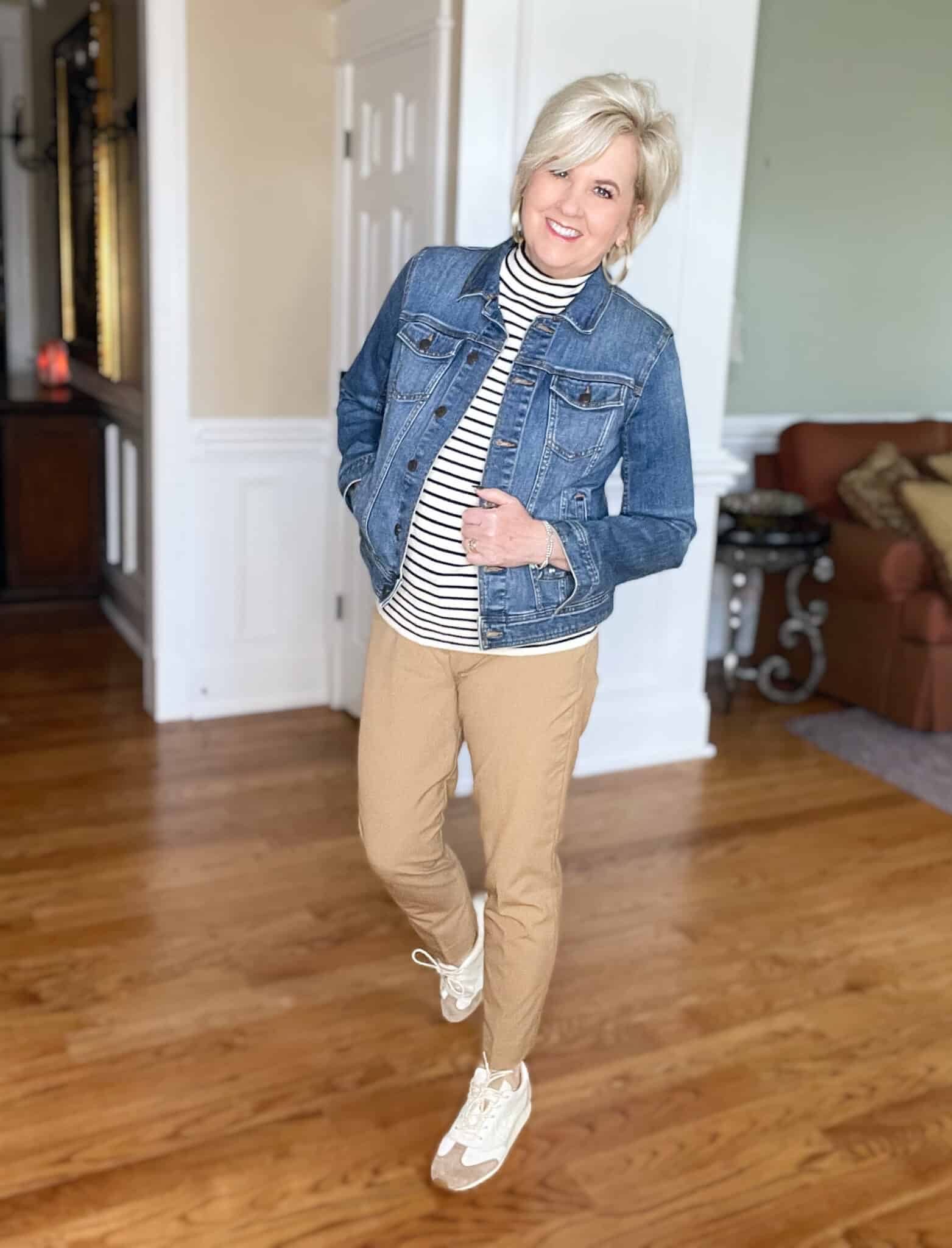 Over 40 Fashion Blogger, Tania Stephens is wearing a nautical sweater with camel pants and a denim jacket