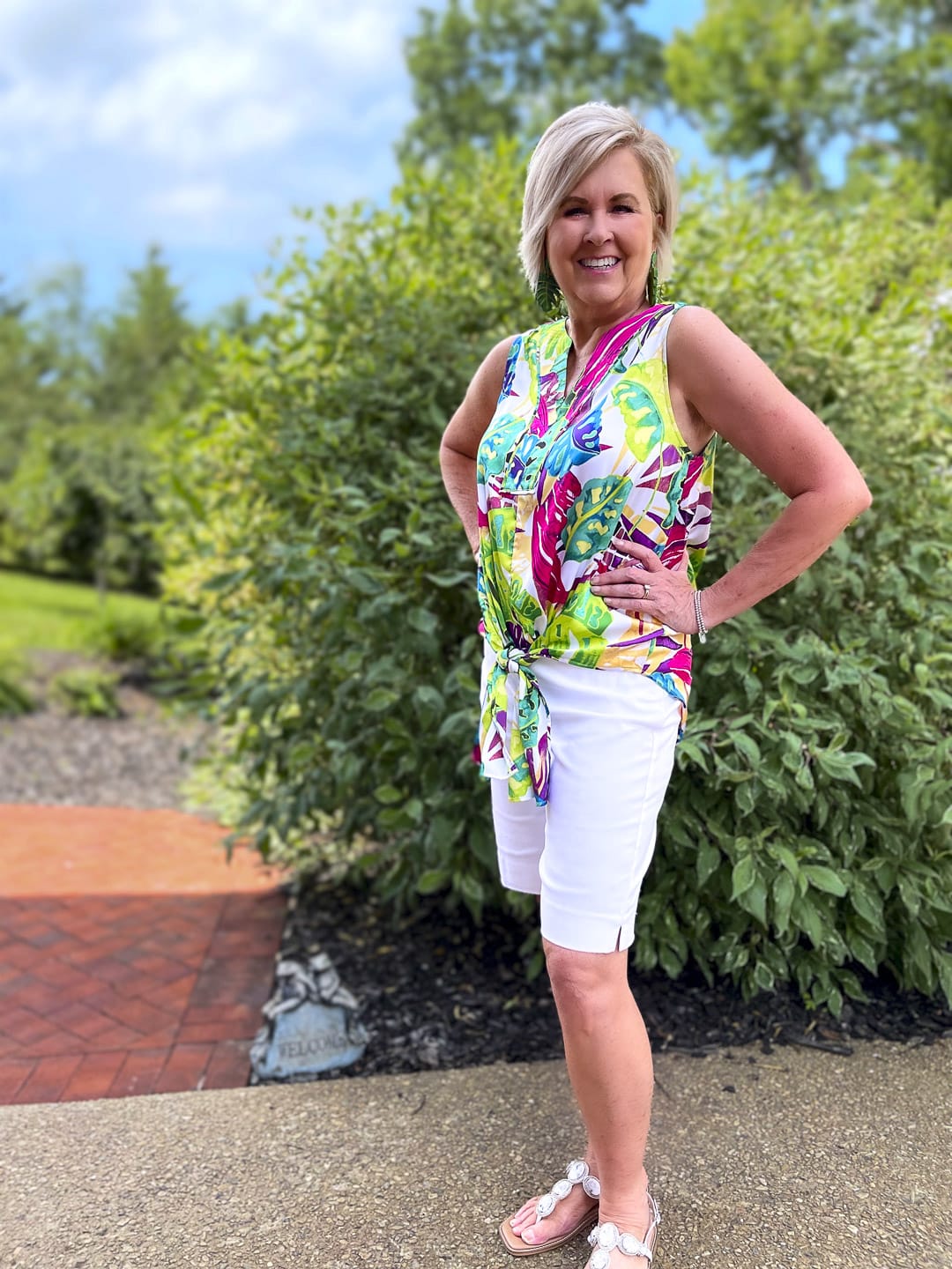 Over 40 Fashion Blogger, Tania Stephens is wearing a brightly colored tie-front top with white bermuda shorts3