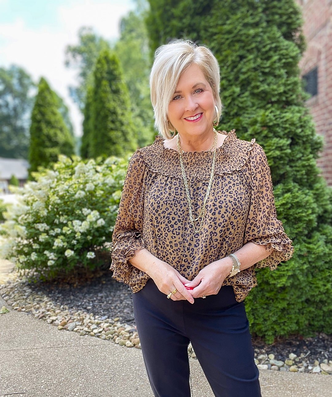 40+ fashion blogger Tanya Stevens styles a leopard off-shoulder top and black pants from SPANX13