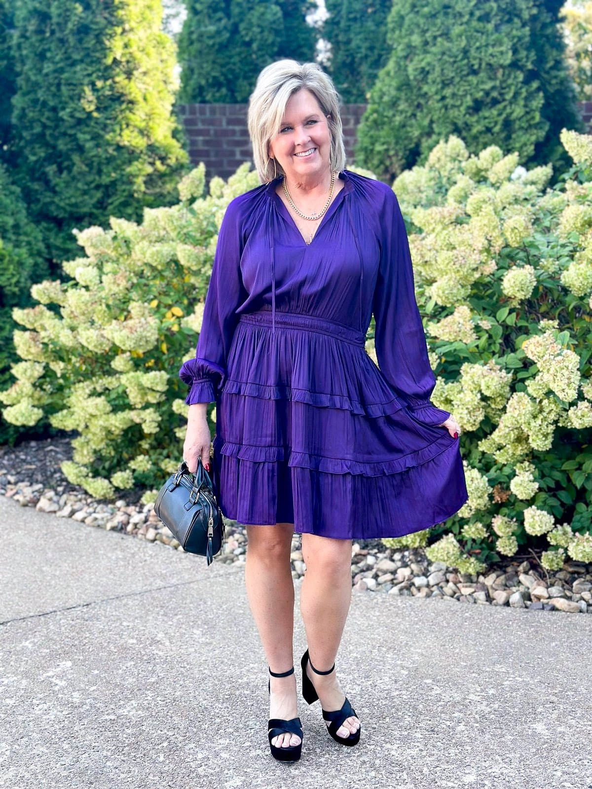 Over 50 Fashion Blogger, Tania Stephens is wearing the latest fall trends from Walmart - Faux Leather Moto Jacket and a tiered Dress20