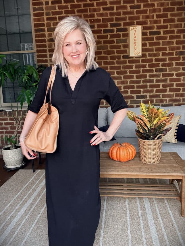 Tania wearing a long black dress which is an essential item every woman needs.