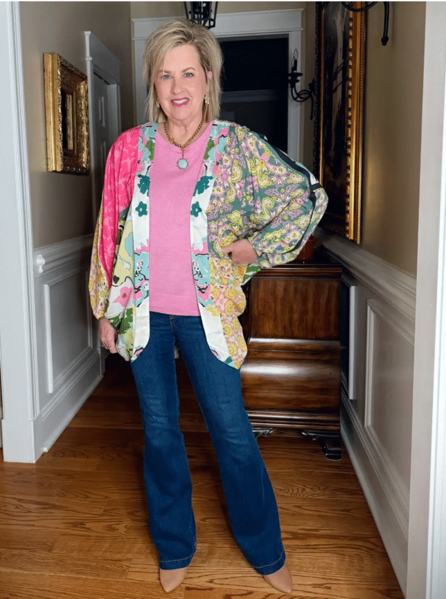 Tania wearing a colorufl ruana and pull on jeans from SPANX