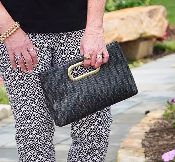 Over 50 Fashion Blogger, Tania Stephens is wearing classic black and white with a ruffled tank and printed crop pants18