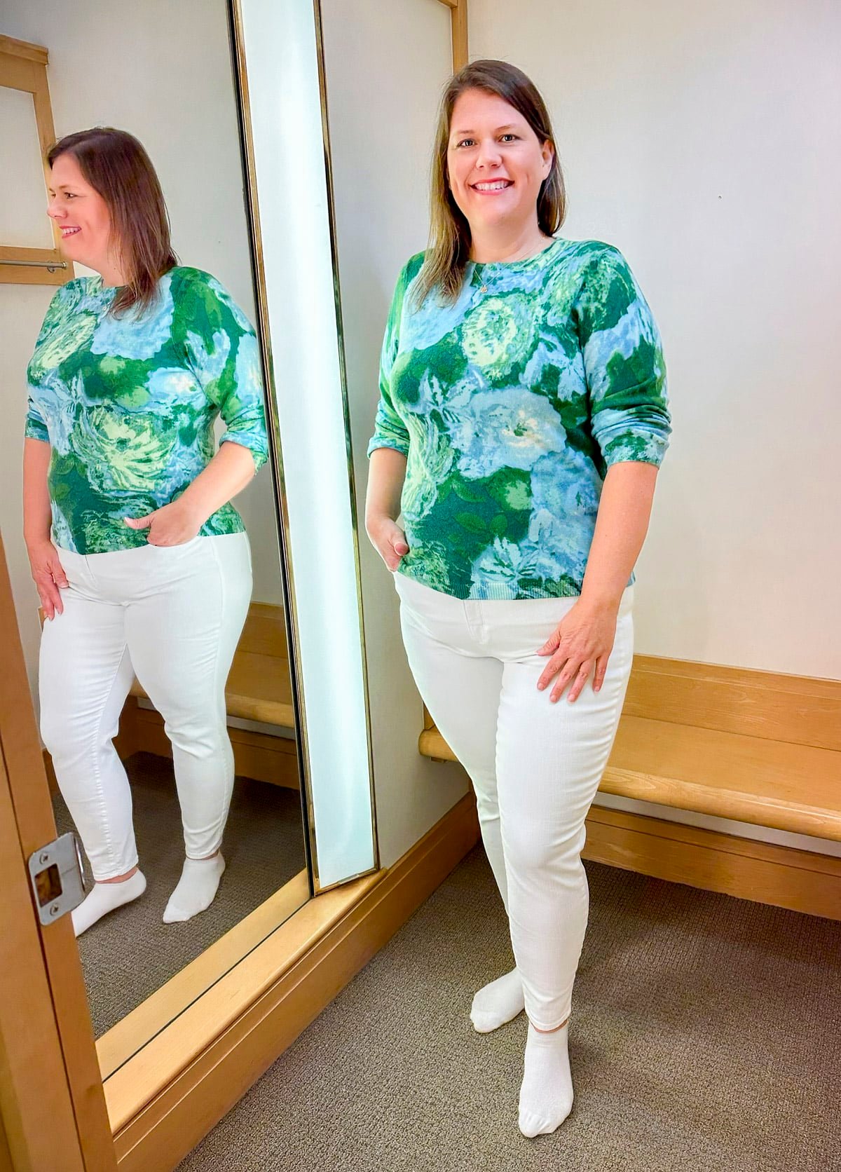 Megan is trying on a Talbots a floral sweater and white jeggings