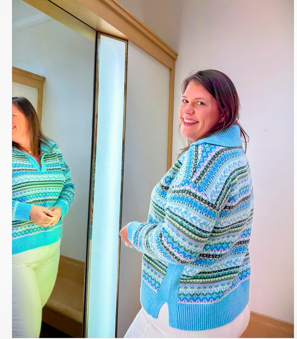 Tania Stephens is trying on a Talbots a striped sweater