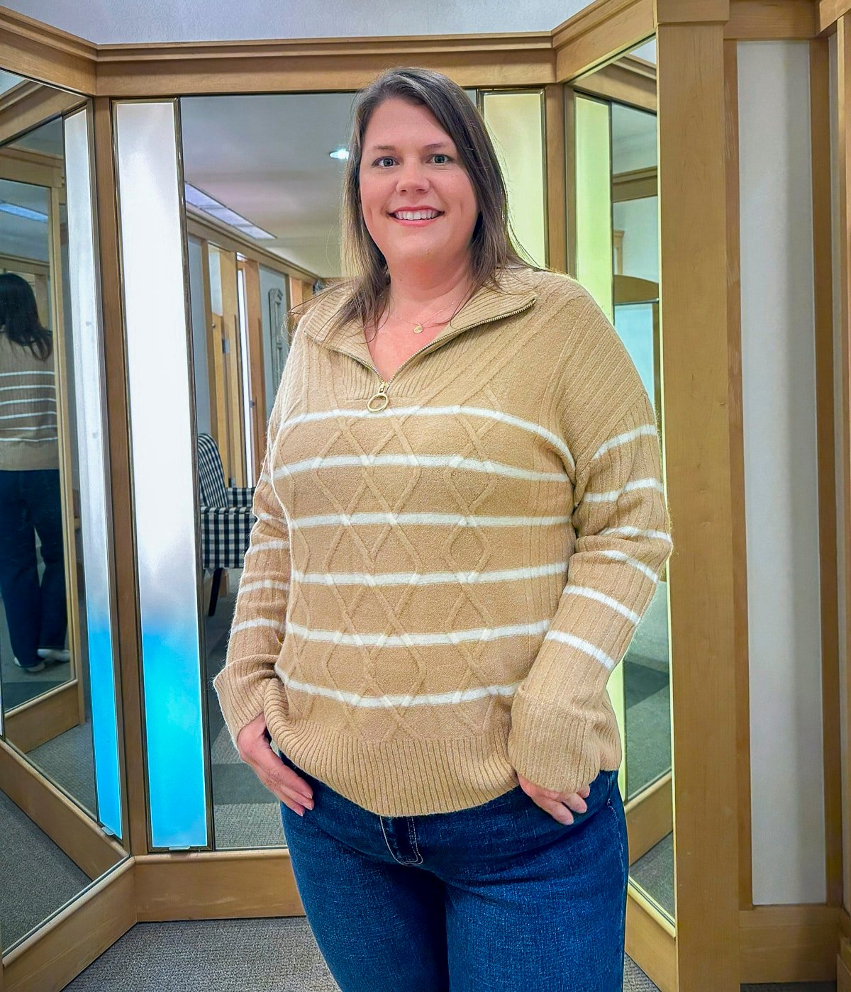 Megan is trying on a Talbots striped sweater