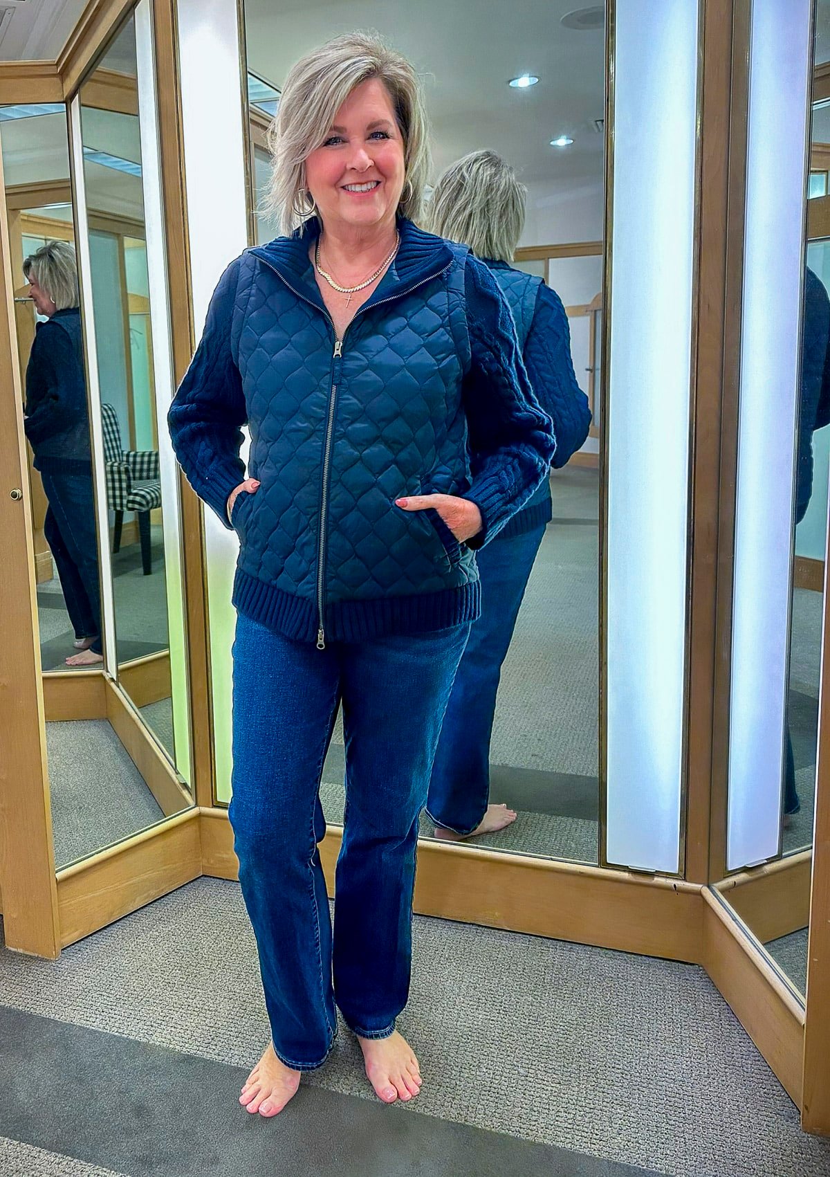 Tania Stephens is trying on a Talbots jacket and bootcut jeans