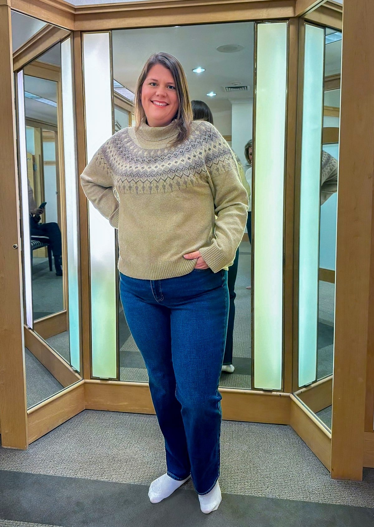 Megan is trying on a Talbots FairIsle sweater and bootcut jeans