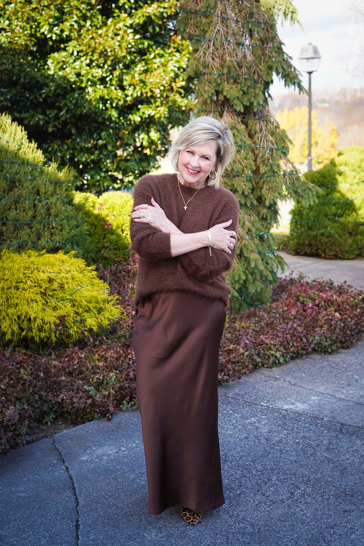 Tania Stephens is wearing Nordstrom Winter Styles with a cozy brown fuzzy sweater and satin slip