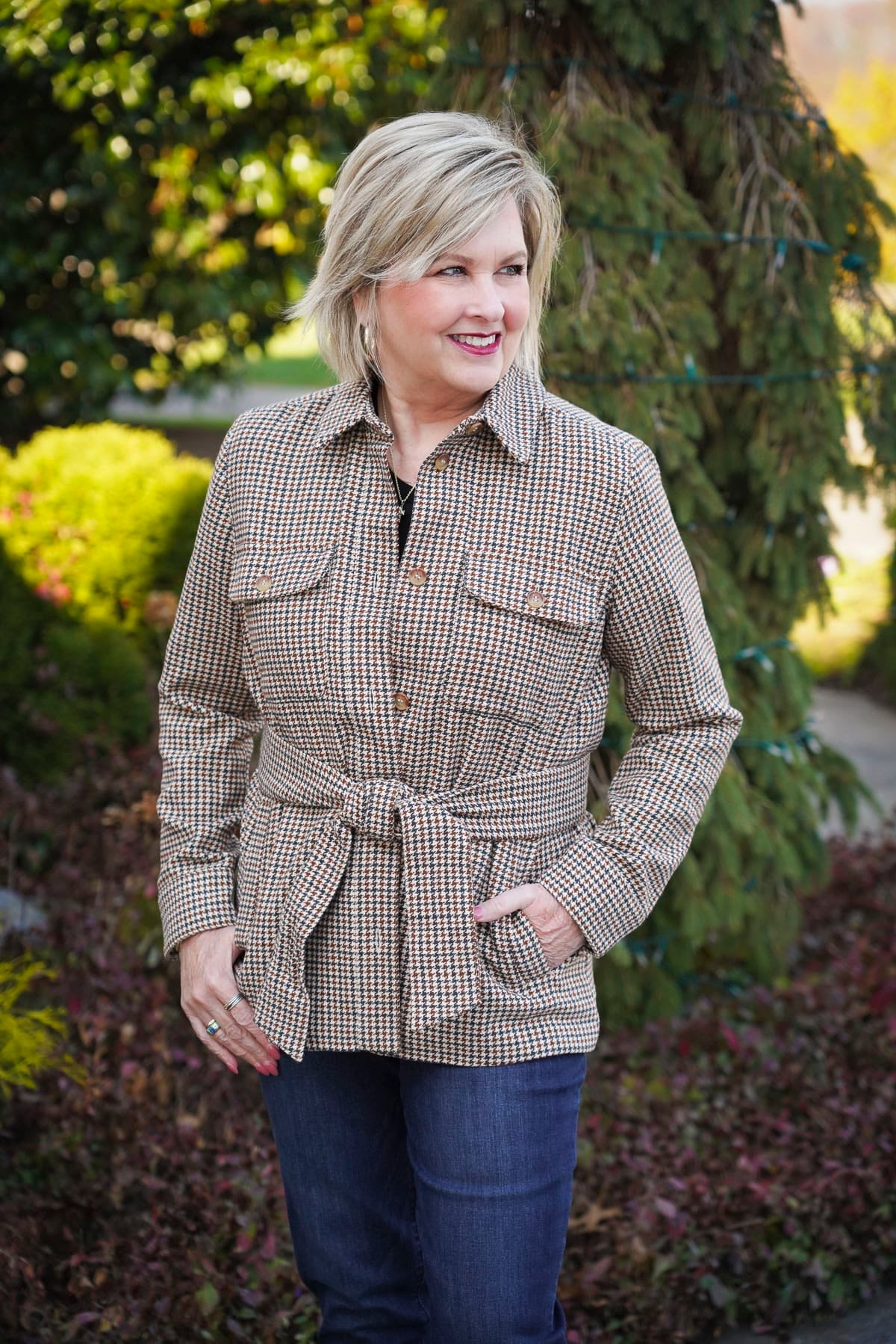 Tania Stephens is wearing a black tee, and a  belted plaid jacket for winter from Nordstrom