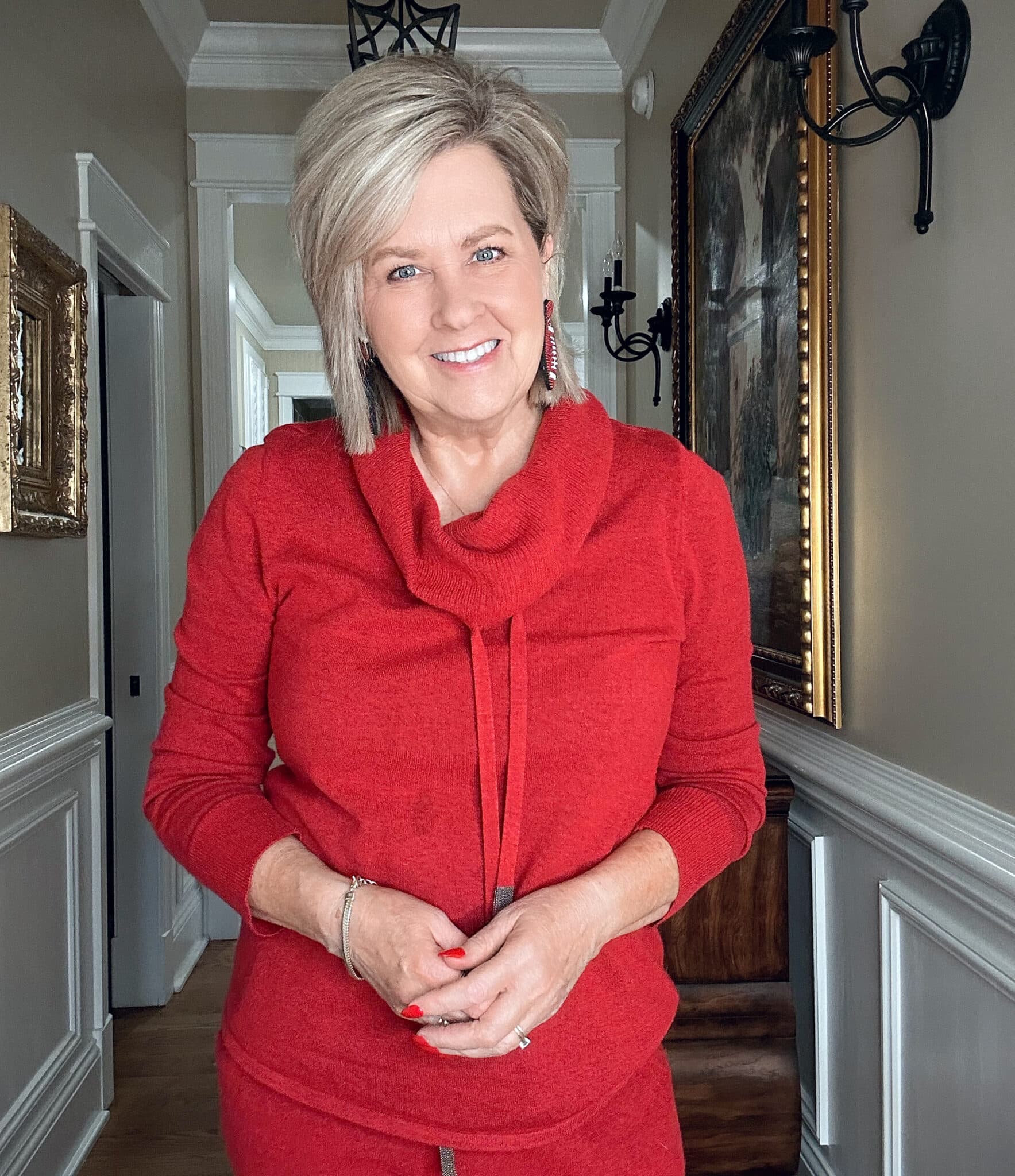 Over 50 Fashion Blogger, Tania Stephens, wearing a red cashmere blend sweater from Chico's