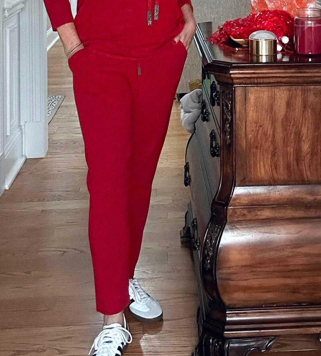 Over 50 Fashion Blogger, Tania Stephens, wearing a red cashmere blend sweater pants from Chico's
