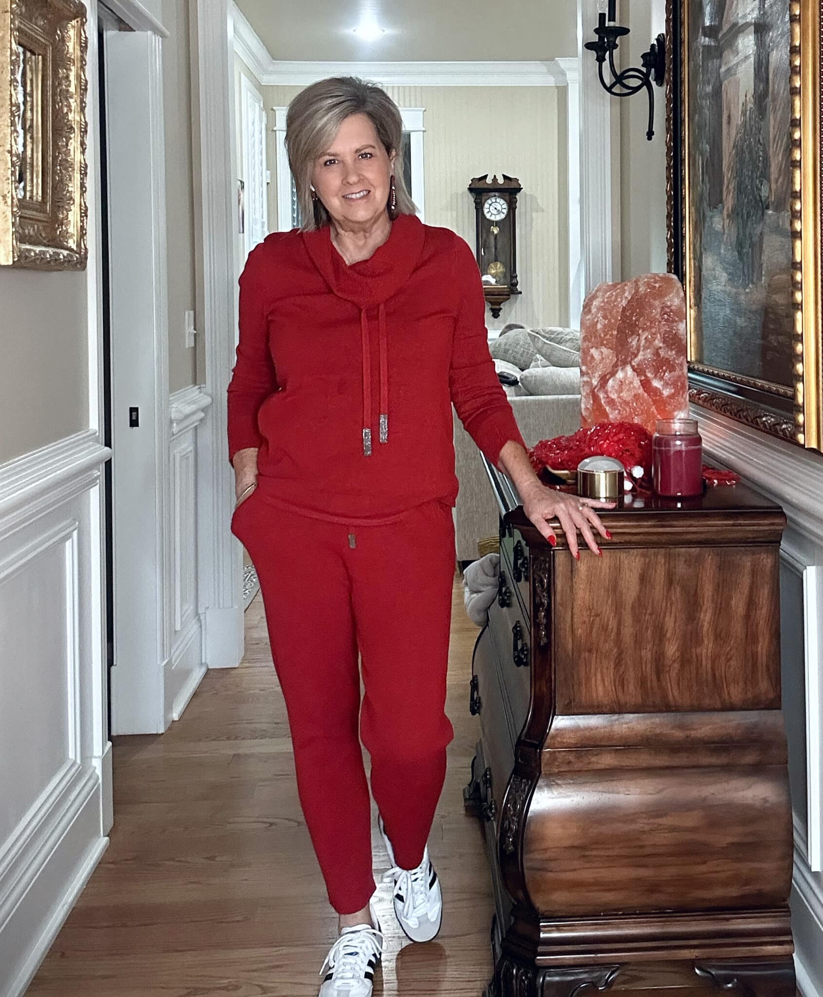 Over 50 Fashion Blogger, Tania Stephens, wearing a red cashmere blend sweater and pants from Chico's