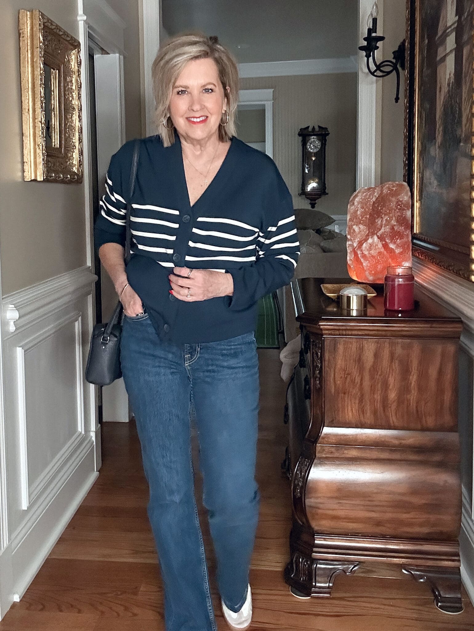 Over 50 Fashion Blogger, Tania Stephens, wearing a SPANX Air Essentials striped top and flare jeans