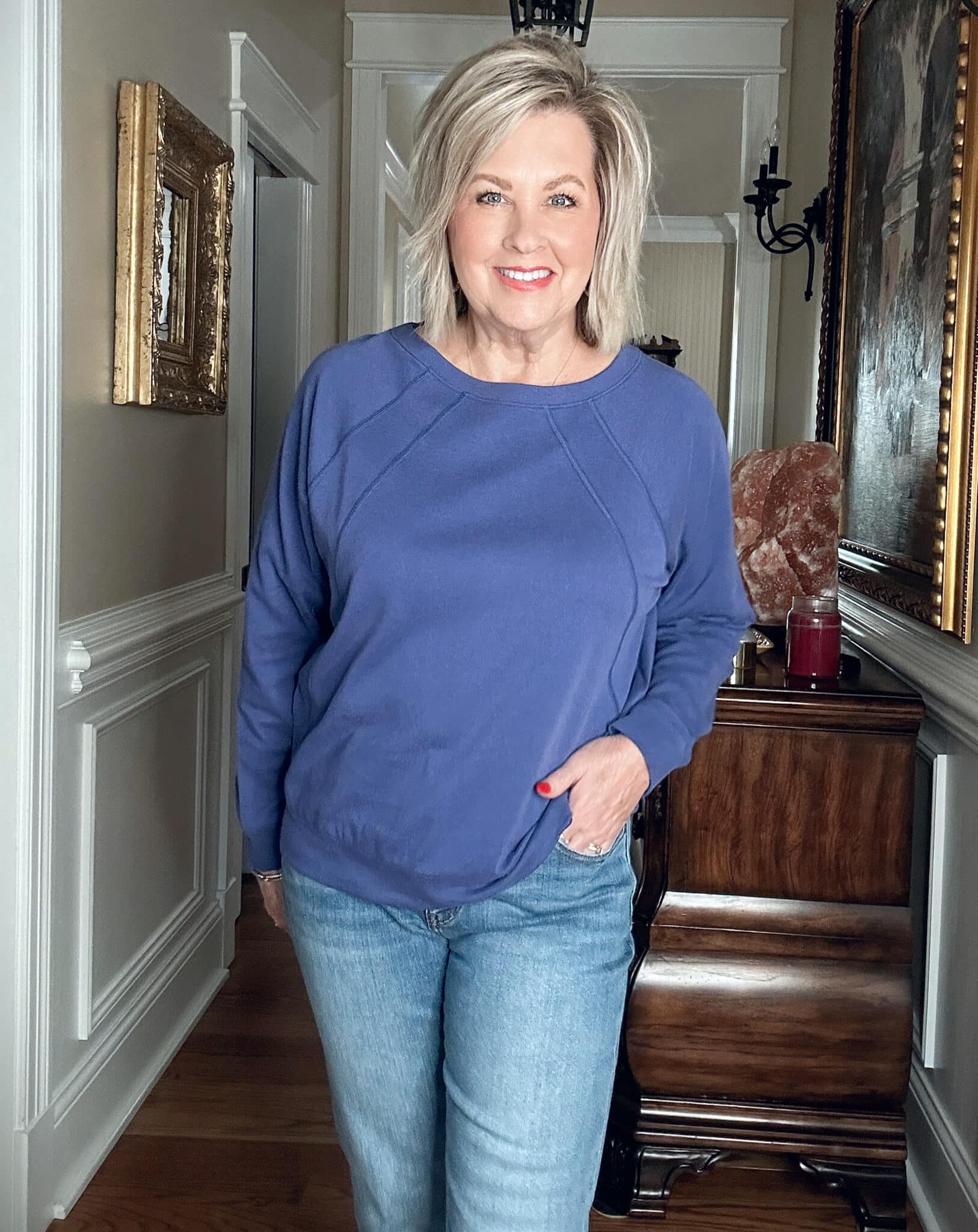 Over 50 Fashion Blogger, Tania Stephens, wearing a purple/blue sweatshirt from J.Jill