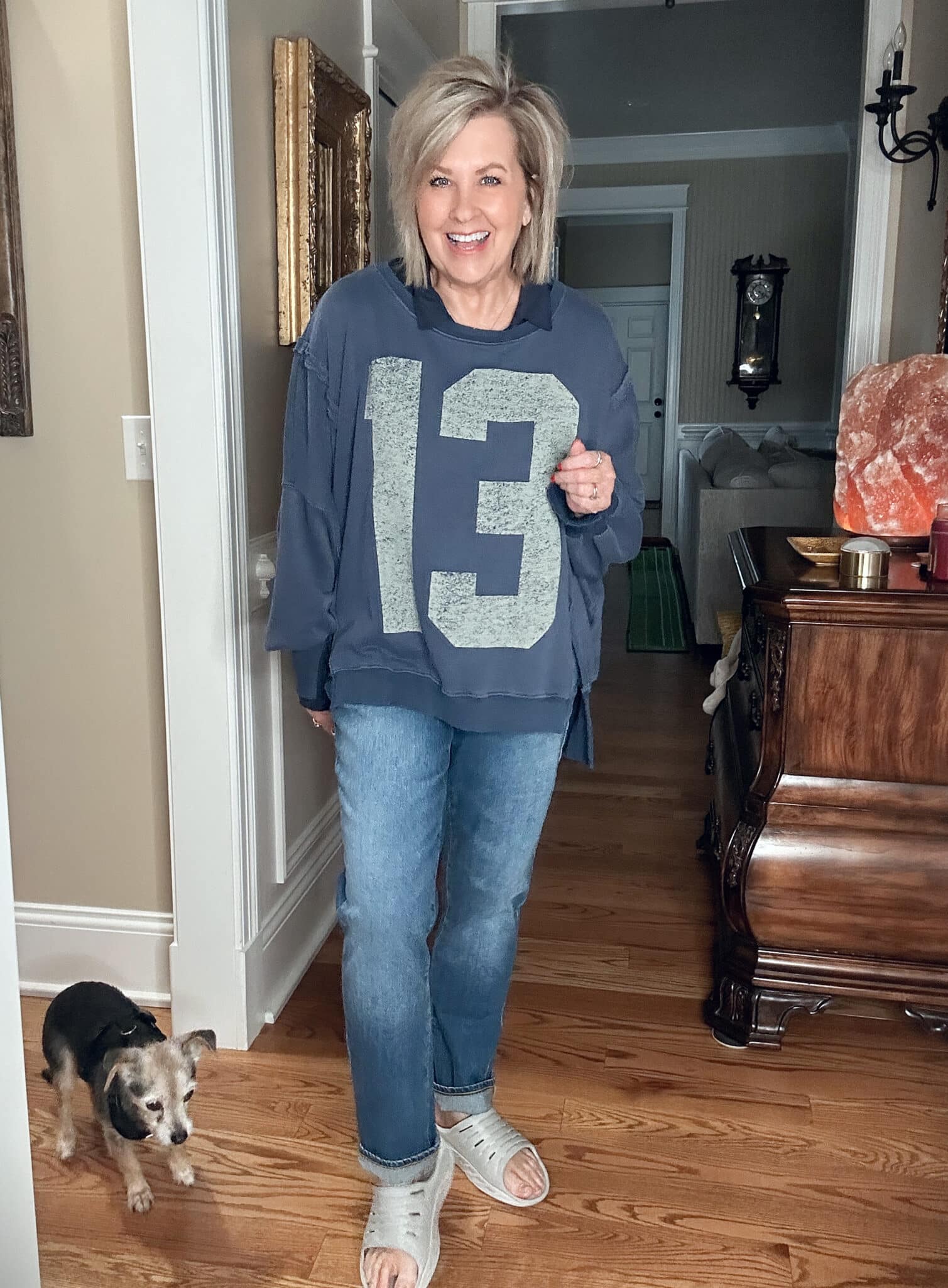 Over 50 Fashion Blogger, Tania Stephens, wearing a #13 blue sweatshirt and jeans