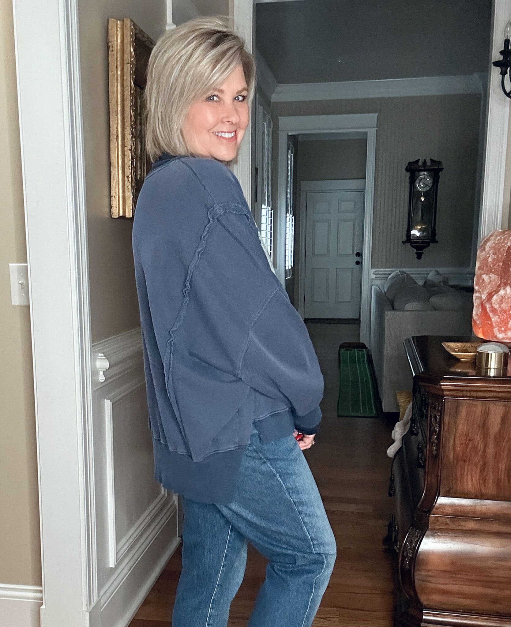 Over 50 Fashion Blogger, Tania Stephens, wearing a blue #13 sweatshirt