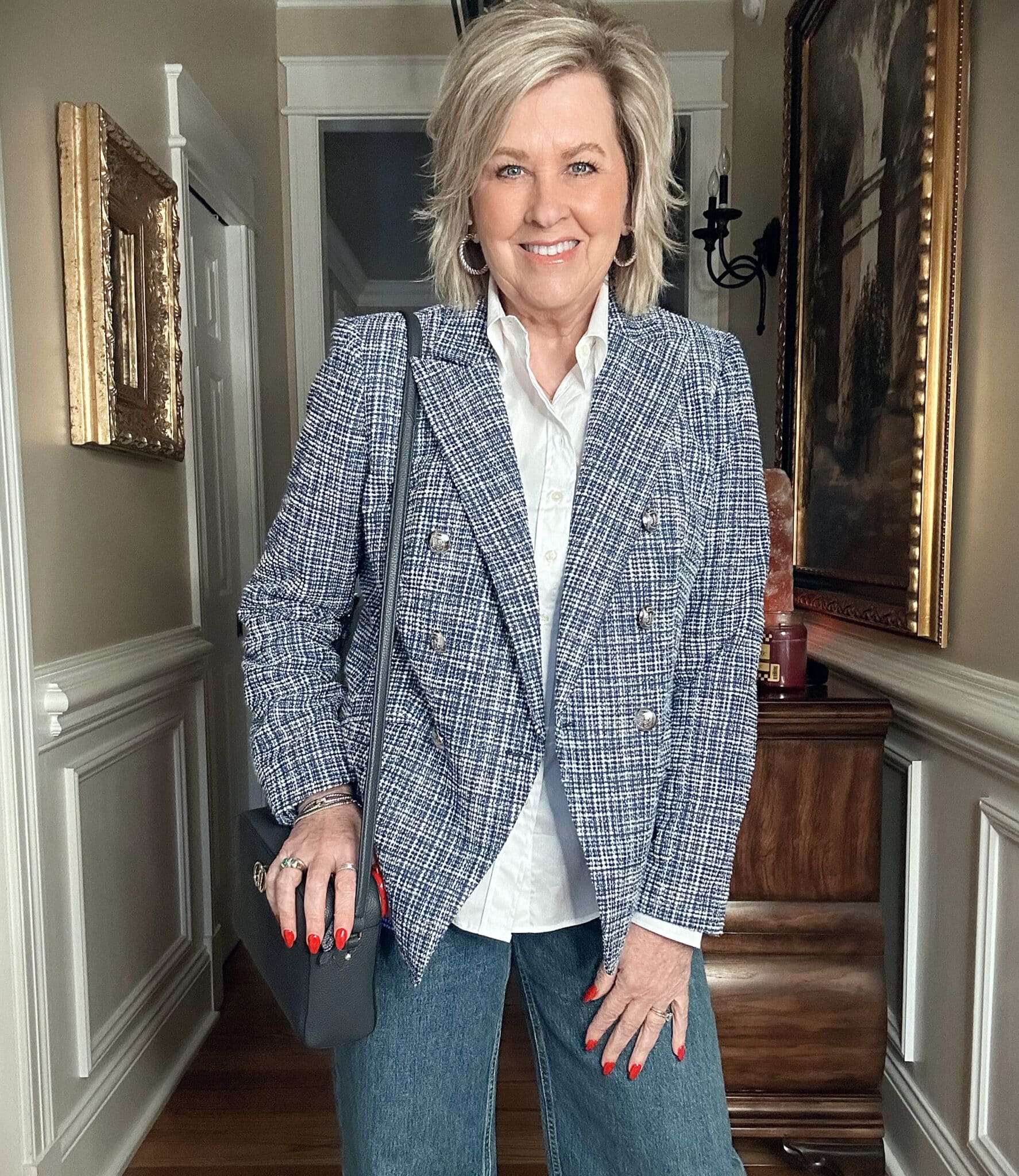 Over 50 fashion blogger, Tania Stephens is wearing a blue tweed blazer and a white button shirt