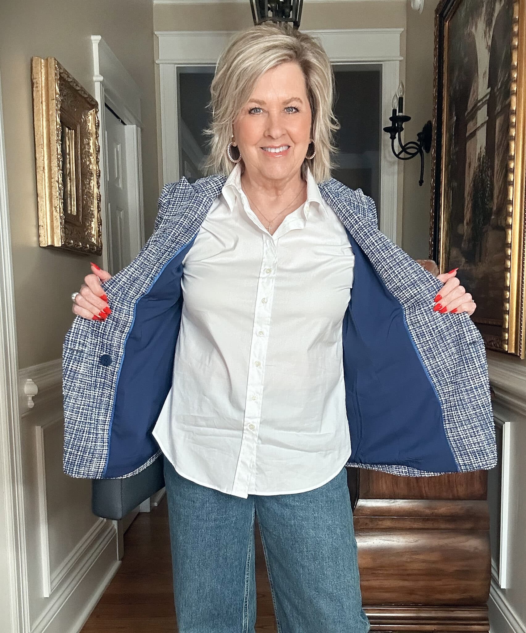 Over 50 fashion blogger, Tania Stephens is wearing a  white button shirt