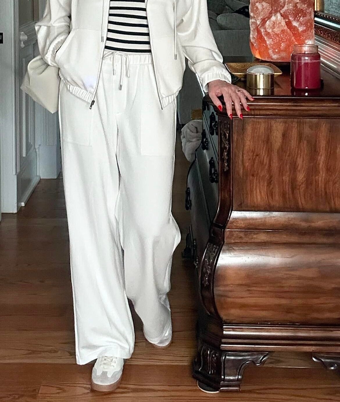 Over 50 Fashion Blogger, Tania Stephens is wearing a neutral outfit consisting of an ivory pair of wide leg pants from Target