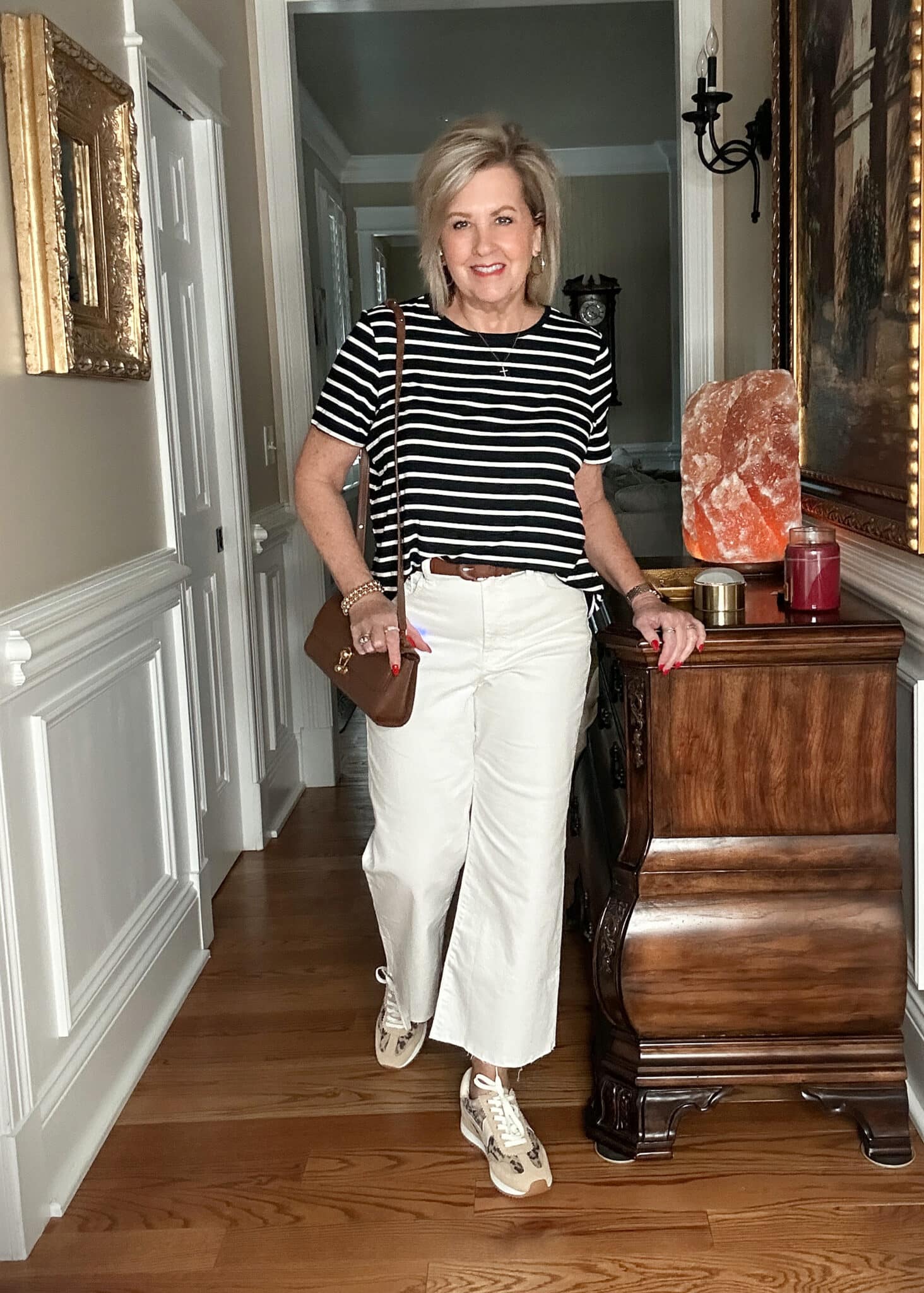 Over 50 Fashion Blogger, Tania Stephens is styling Old Navy clothing - black & white tee and white crops