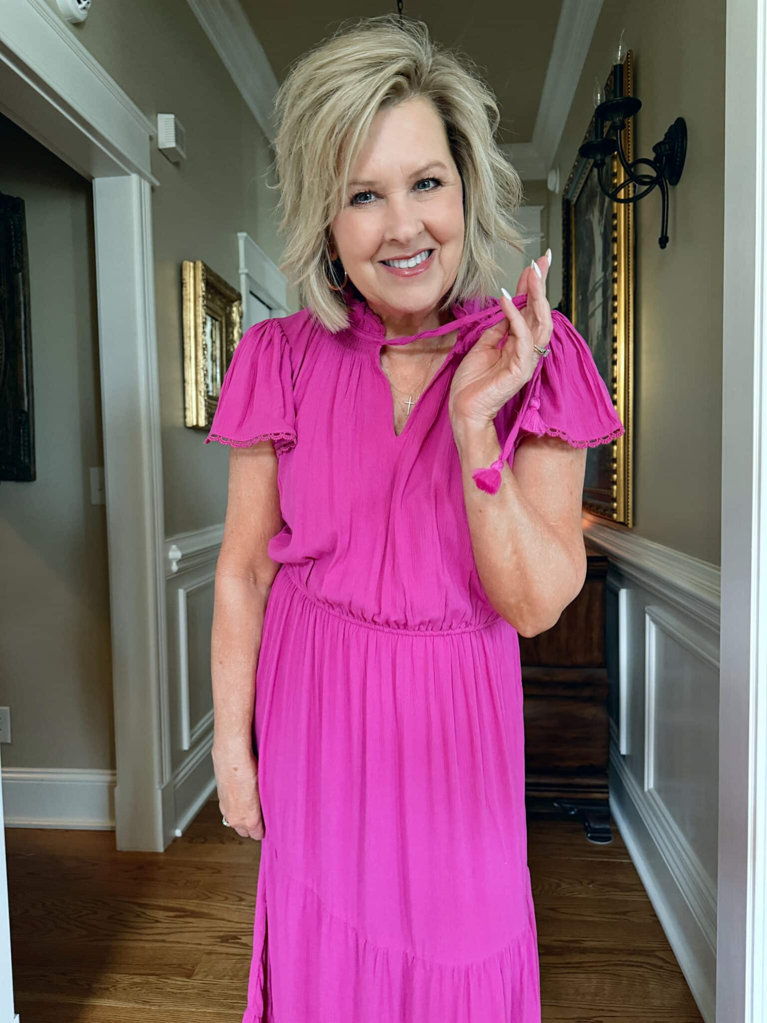 Tania Stephens is wearing fuchsia dress from Walmart
