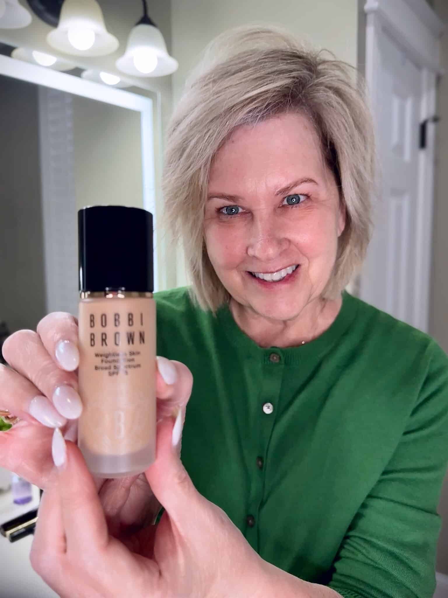 Tania Stephens in a green sweater with Bobbi Brown foundation makeup from Nordstrom Beauty