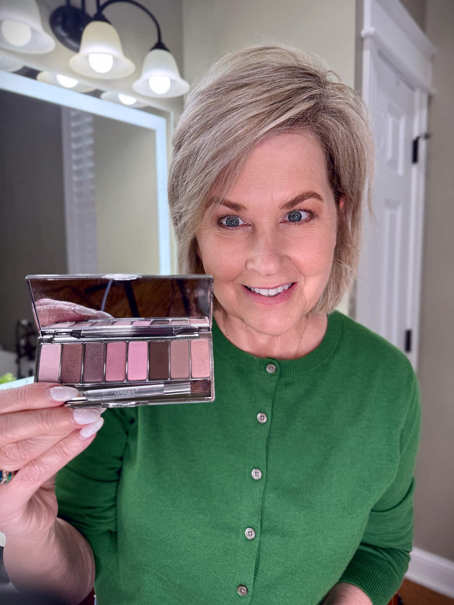 Tania Stephens in a green sweater with Clinique syeshadow makeup from Nordstrom Beauty