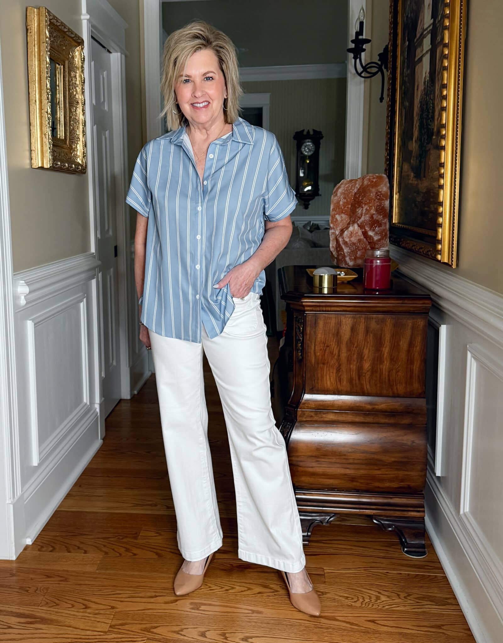 Tania Stephens is wearing a pair of white jeans and a blue and white striped top from Amazon