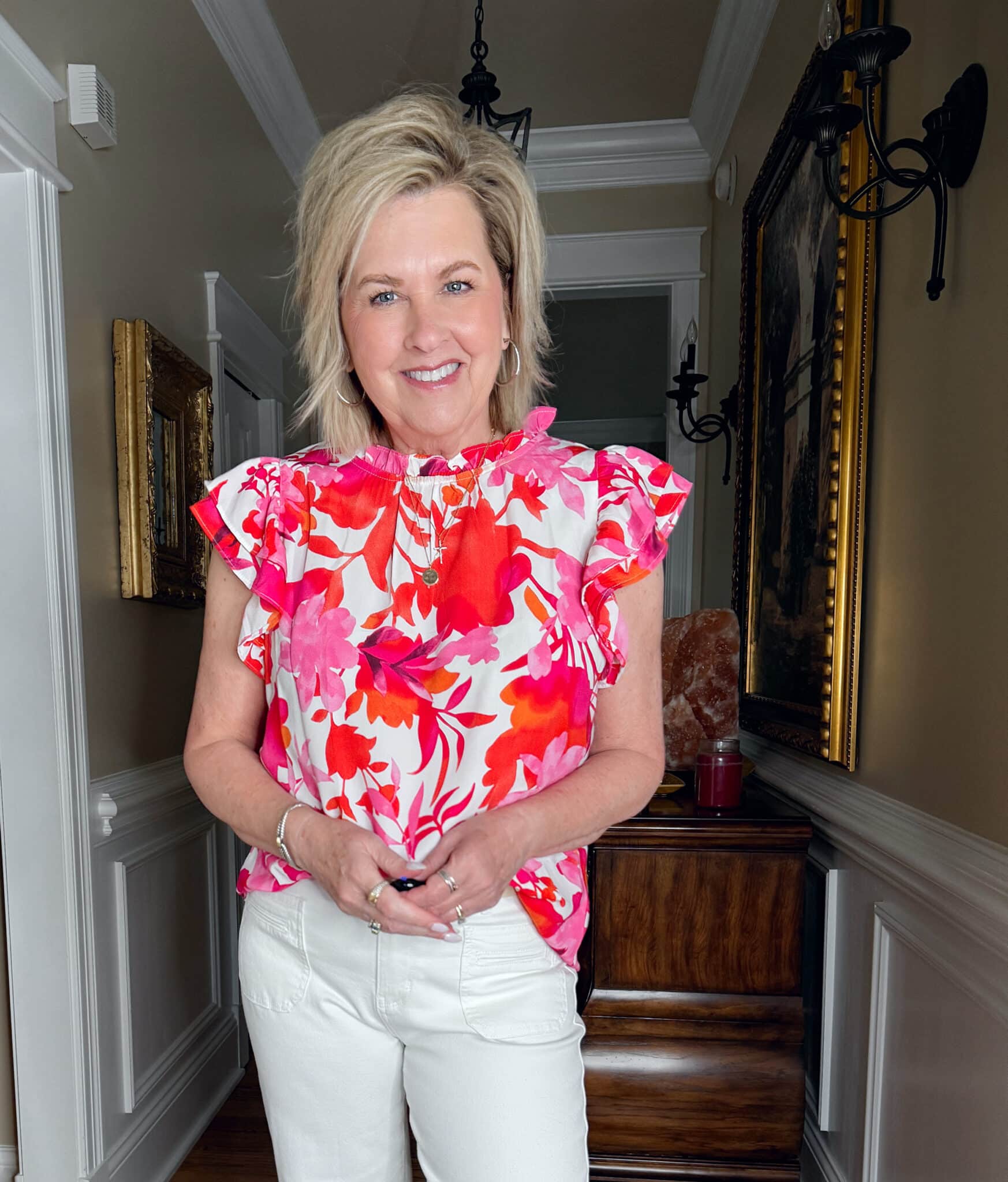 Tania Stephens is wearing a bright pink flutter sleeve top from Amazon