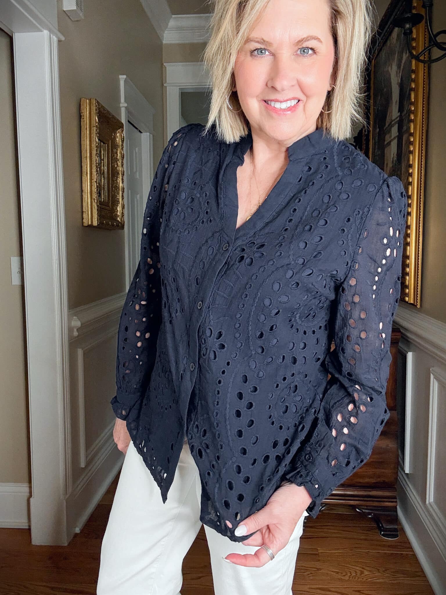 Tania Stephens is wearing a navy lace shirt