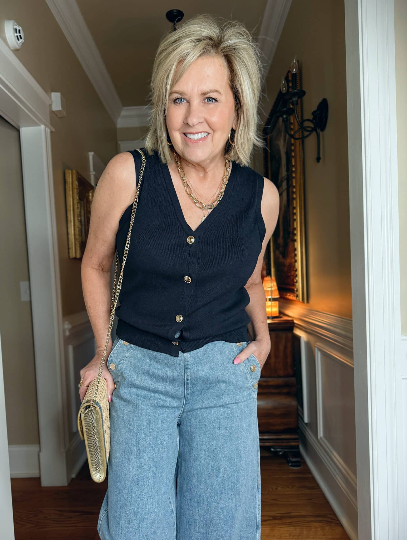 Tania Stephens is wearing a navy button vest