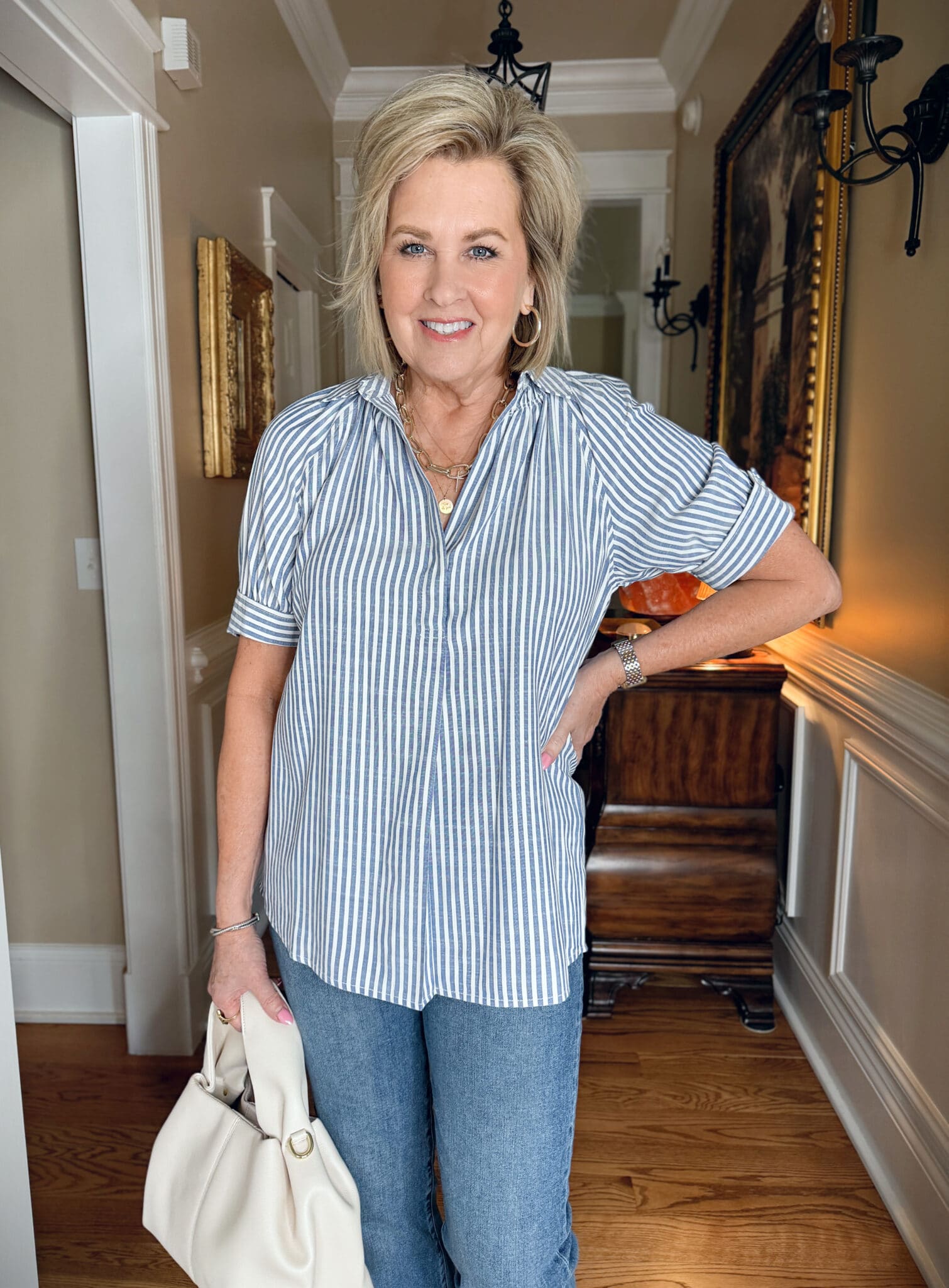 Tania Stephens wearing a pale blue striped smoked top 